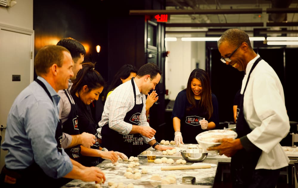 How do Corporate Cooking Classes Build Morale? | Team cooking food