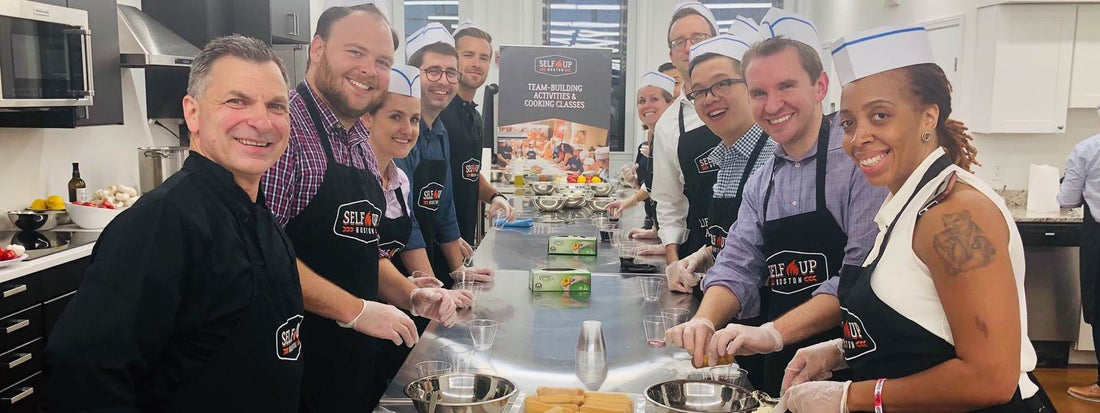 Heating up team-building: benefits of booking a cooking class | Team photo