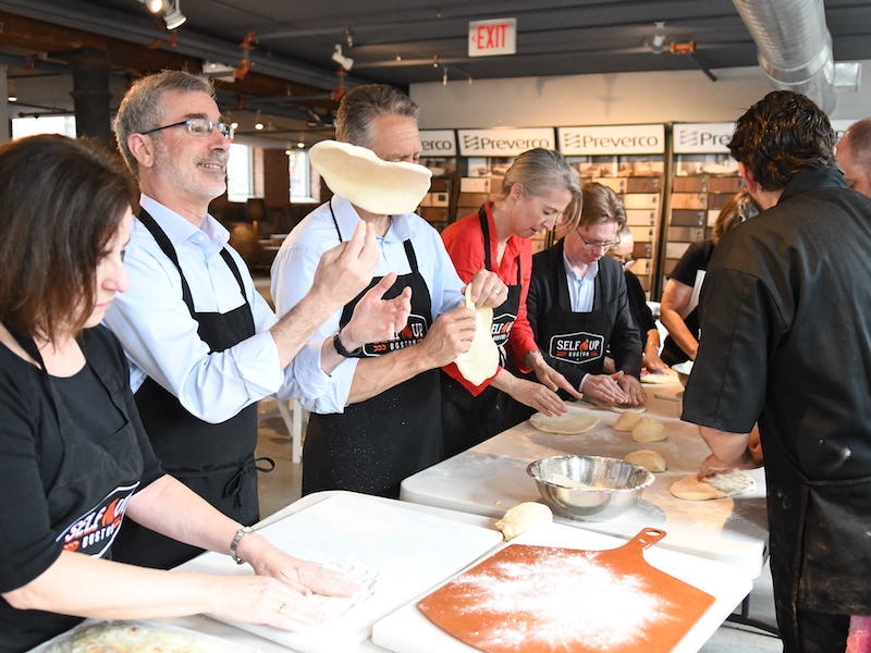 Pizza Making Team Building | Man Tossing Pizza Dough